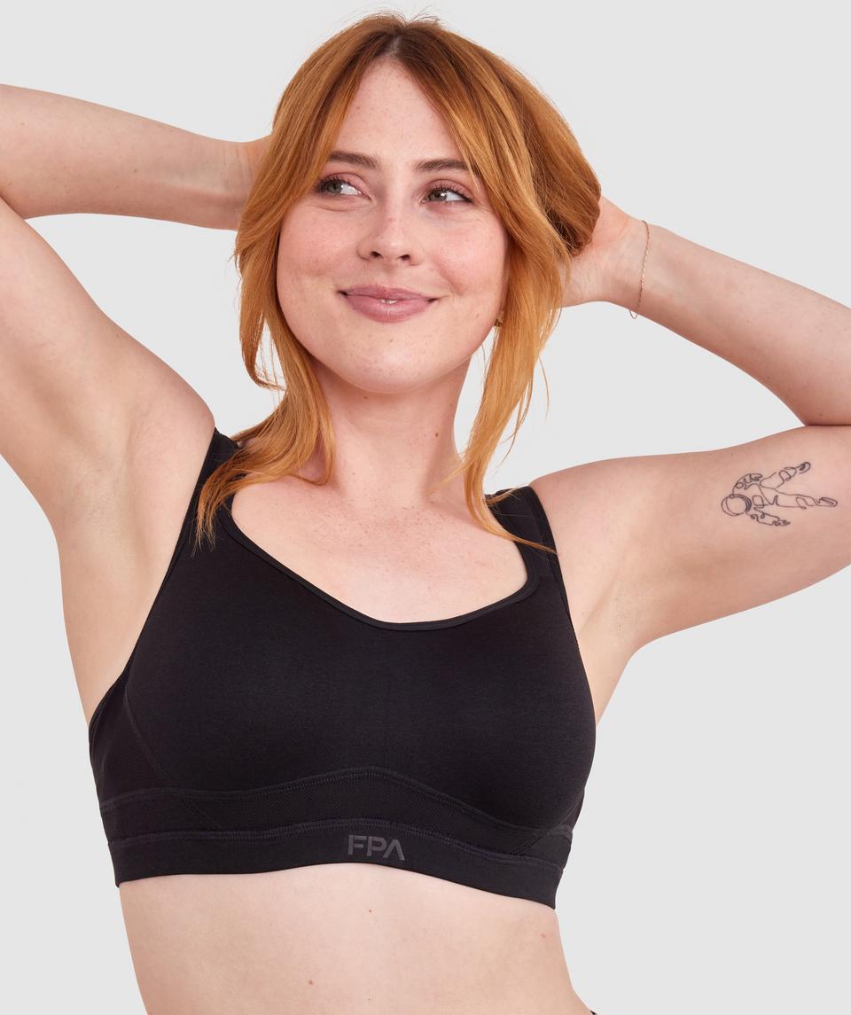 Lucy is wearing a 12DD top and 12 bottom. She stands at 165cm/5'4in.